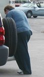 I saw a mechanic hop out of his car, sans boots. I don't believe I've ever made a u-turn as quickly as I did, that day.